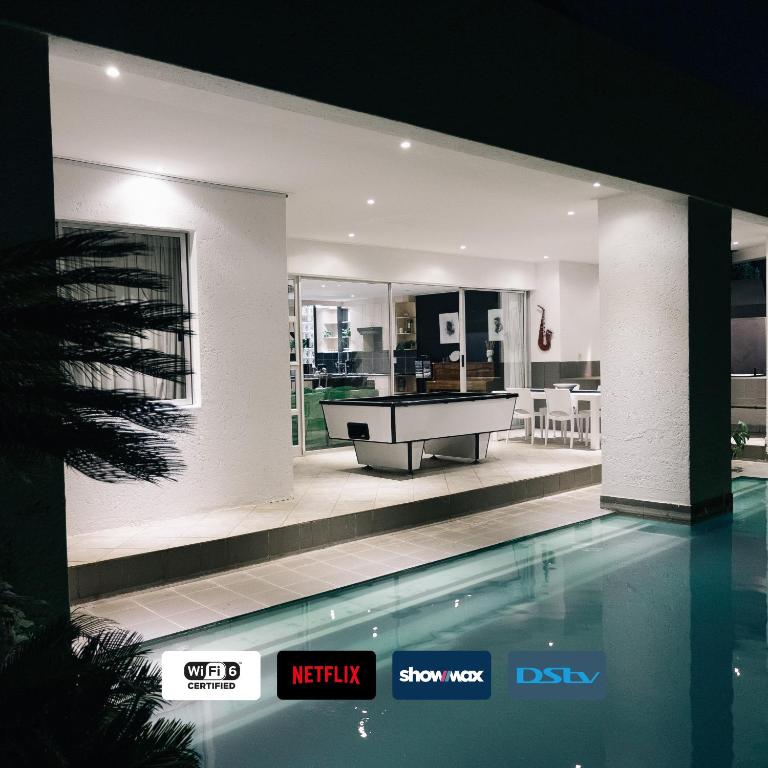 an image of a house with a swimming pool at Poolside Villa in Johannesburg