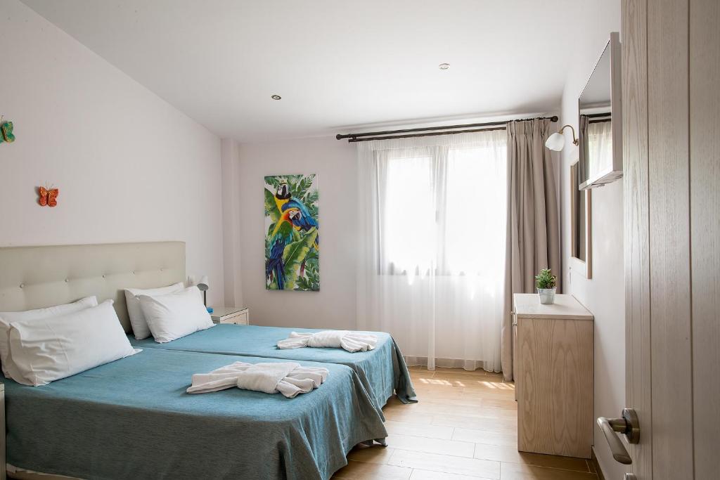 Postel nebo postele na pokoji v ubytování Spiti Prifti Apartments