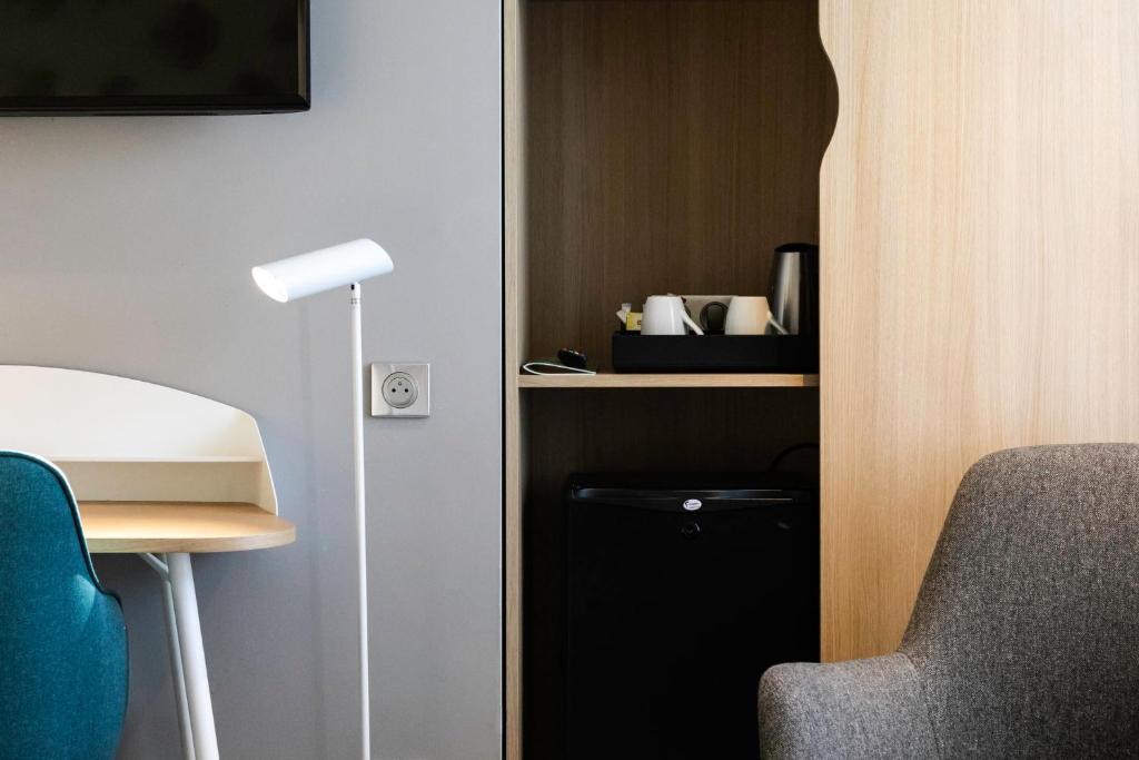 Телевизор и/или развлекательный центр в Holiday Inn Perpignan by IHG