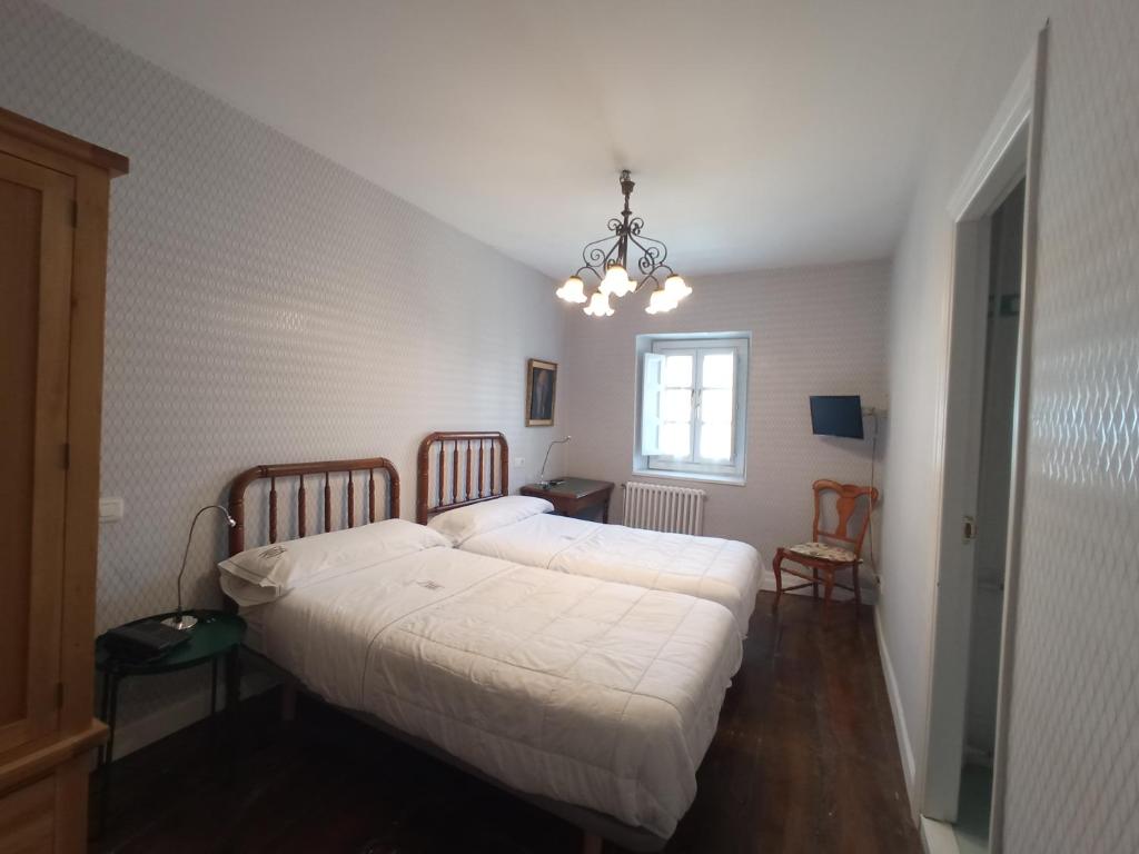 Postel nebo postele na pokoji v ubytování Hotel Ormazabal