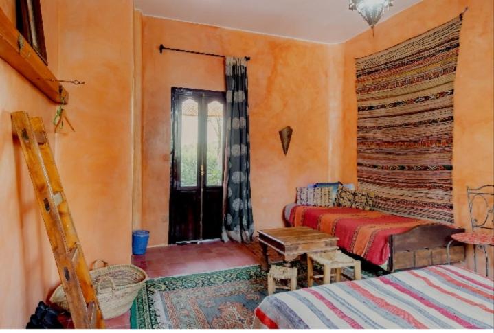 Ένα ή περισσότερα κρεβάτια σε δωμάτιο στο Hajrienne guest house