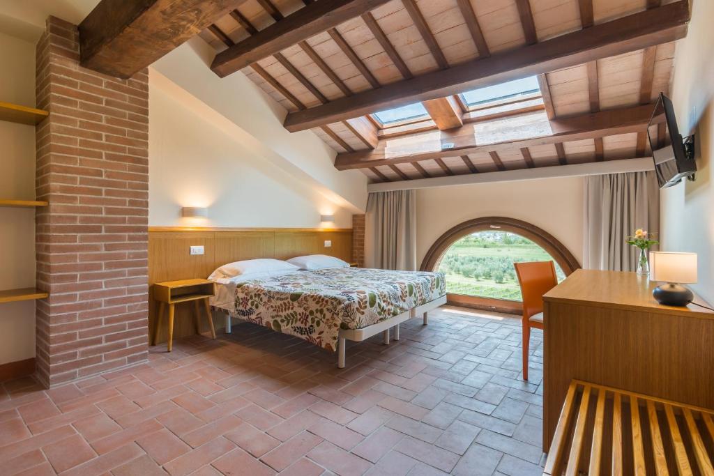 Postel nebo postele na pokoji v ubytování Collina dei Poeti