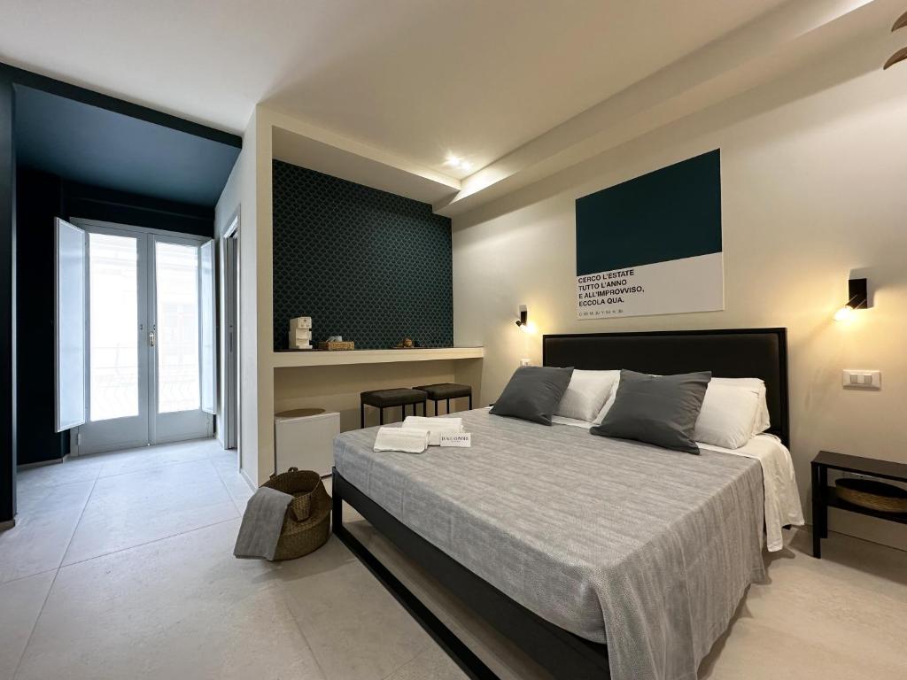Postel nebo postele na pokoji v ubytování D'Aleammare - Rooms