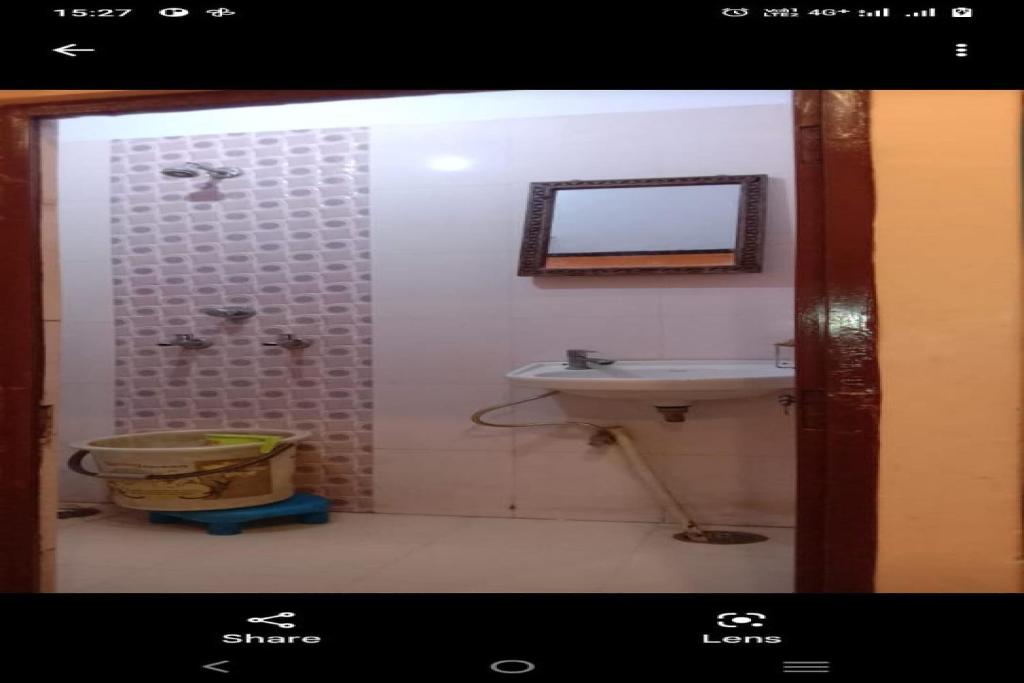 Ванная комната в Mahadev Hotel