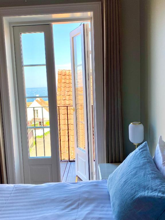 En eller flere senge i et værelse på JANTZENs HOTEL