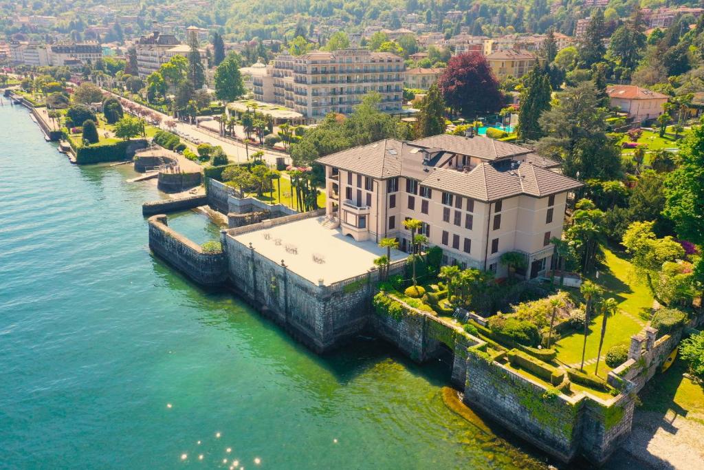 an aerial view of a house next to the water at Wonderful Stresa apartment in Stresa
