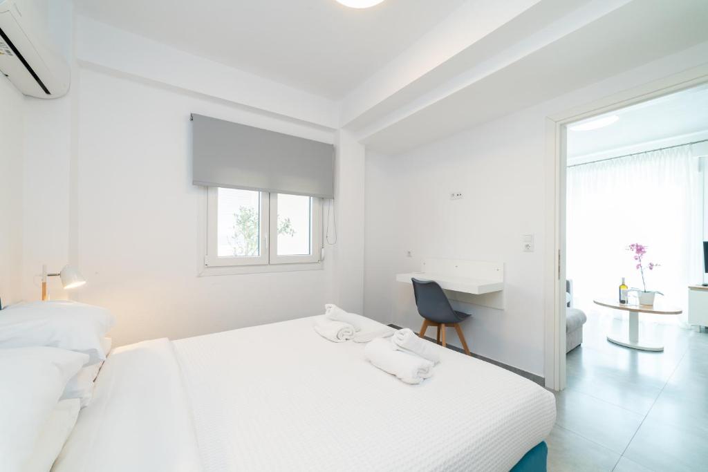 Postel nebo postele na pokoji v ubytování Dionysos Residential Complex