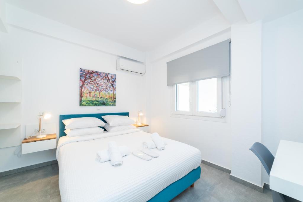 Postel nebo postele na pokoji v ubytování Dionysos Residential Complex