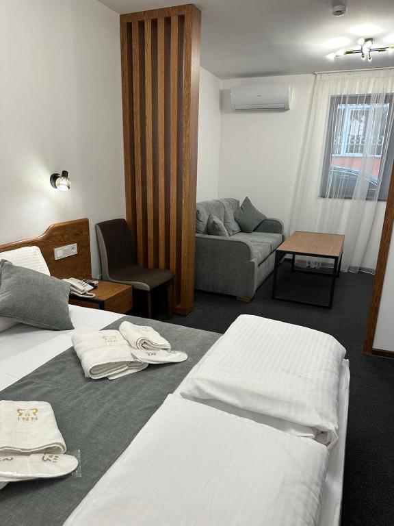 Postel nebo postele na pokoji v ubytování R&R Hotel