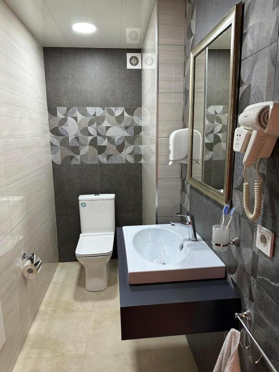 Koupelna v ubytování R&R Hotel