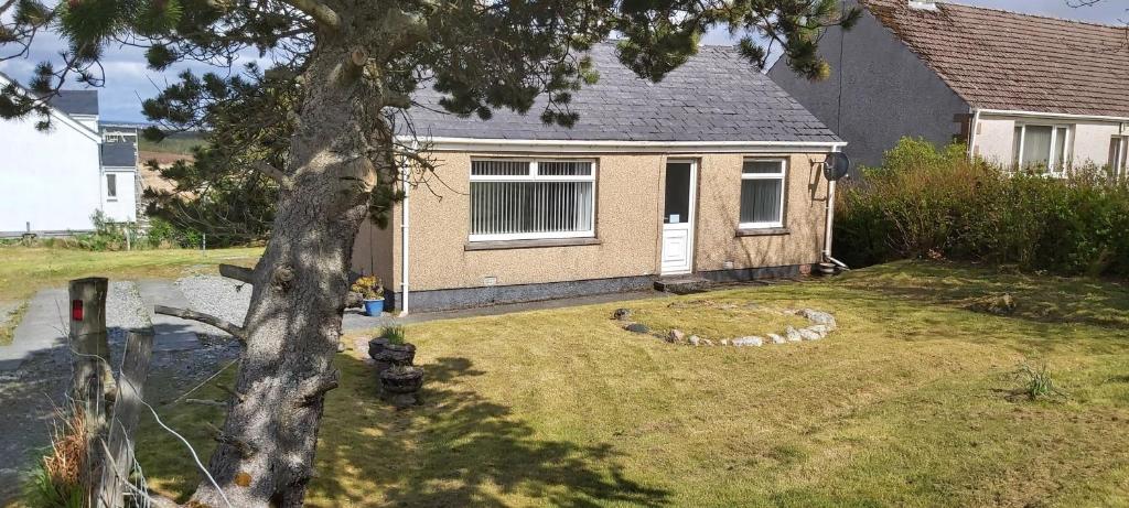 a house with a yard with a fire hydrant at Newmarket in Stornoway