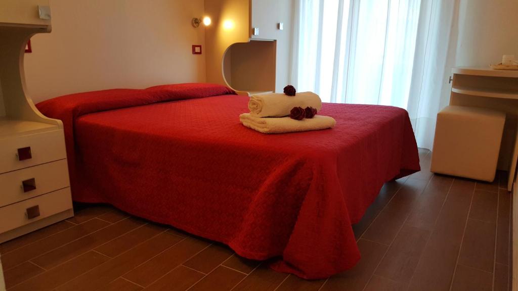 Łóżko lub łóżka w pokoju w obiekcie Hotel Perla Verde