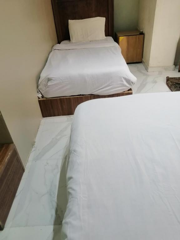 Postel nebo postele na pokoji v ubytování Gardenia Hotel