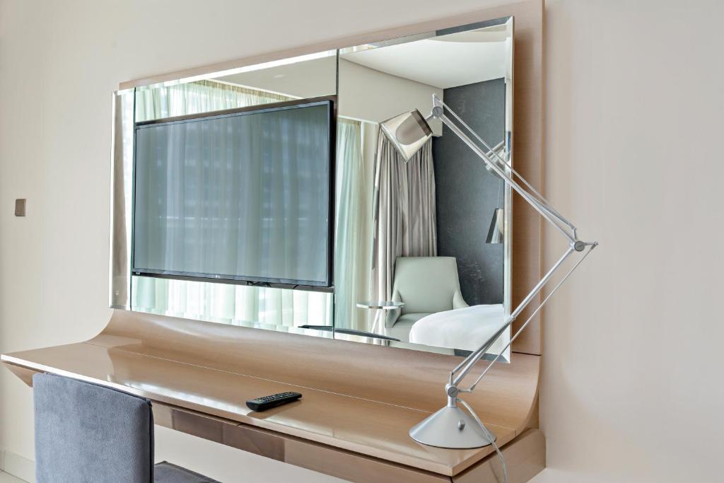 Postel nebo postele na pokoji v ubytování ALiving Luxury 1BR Paramount Towers Business Bay 6205