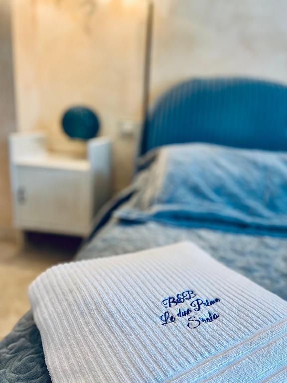 Postel nebo postele na pokoji v ubytování Le due palme Bed & Breakfast