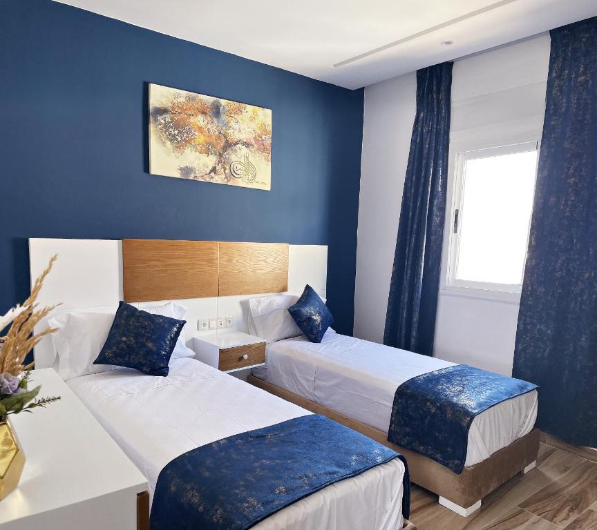 Cama o camas de una habitación en HOSTAL MH BORJ