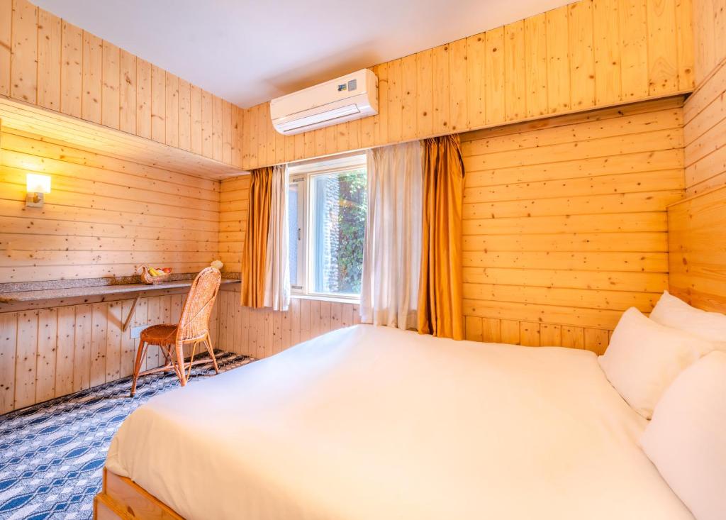 Postel nebo postele na pokoji v ubytování Hotel Mirage