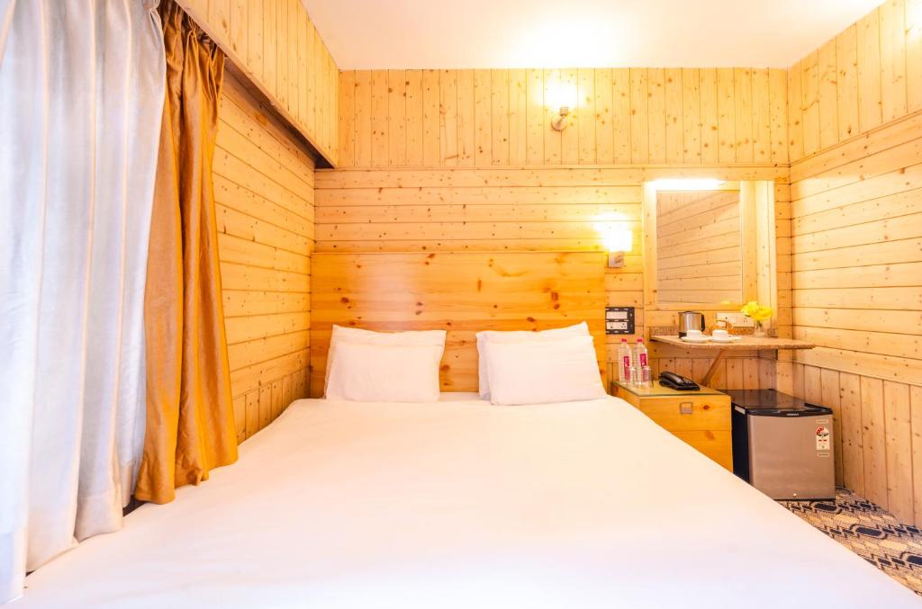 Postel nebo postele na pokoji v ubytování Hotel Mirage