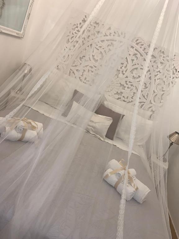 A bed or beds in a room at La Siciliana-di fronte la Cattedrale