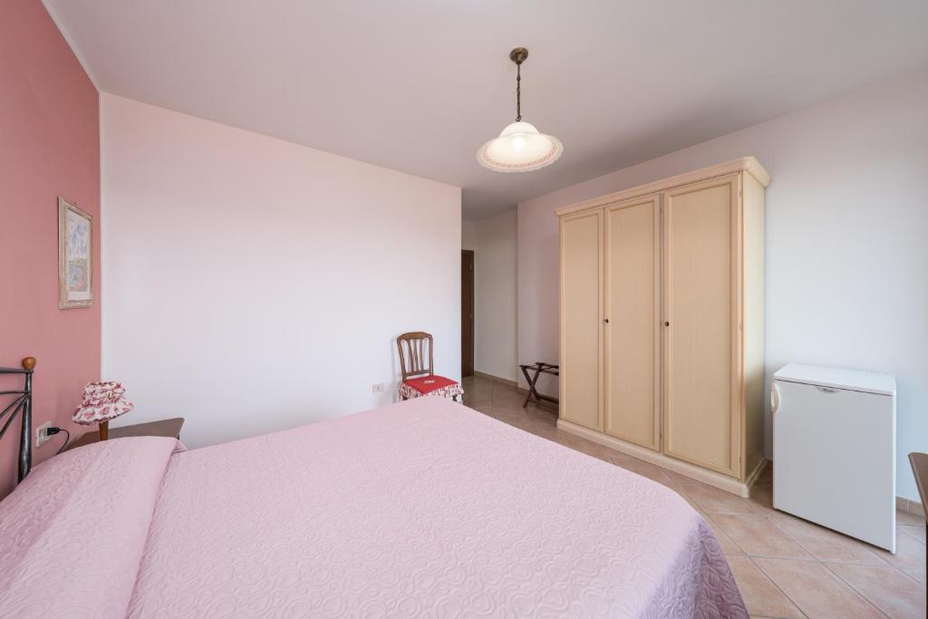 Postel nebo postele na pokoji v ubytování Agriturismo Daniela