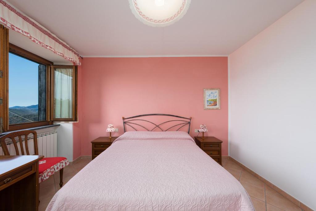 Postel nebo postele na pokoji v ubytování Agriturismo Daniela