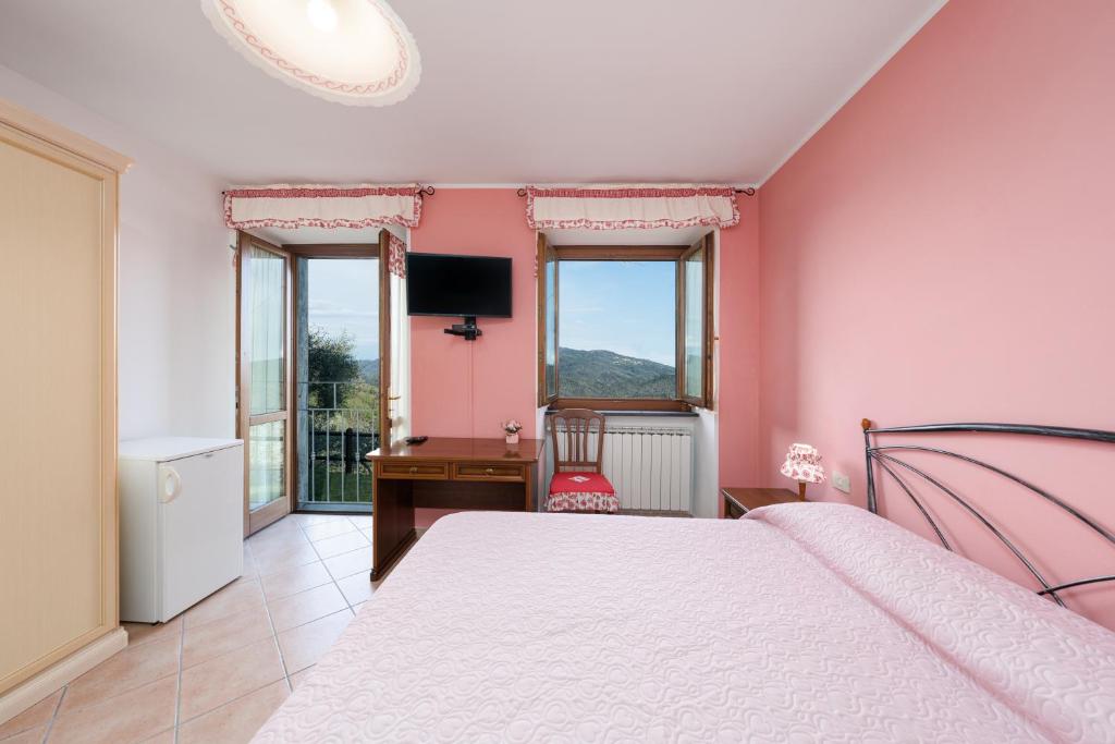 Postel nebo postele na pokoji v ubytování Agriturismo Daniela
