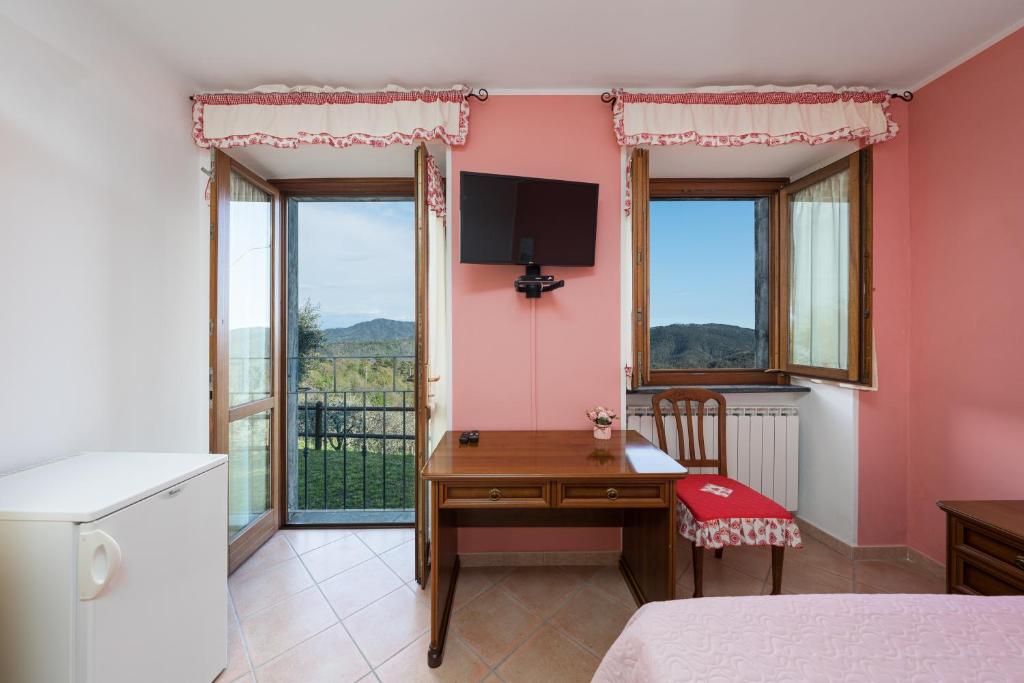 Postel nebo postele na pokoji v ubytování Agriturismo Daniela