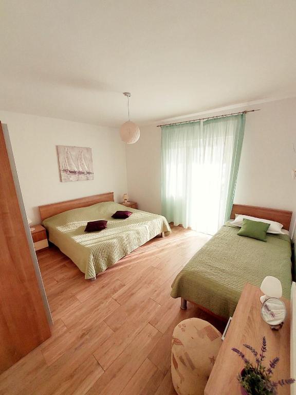 Postel nebo postele na pokoji v ubytování Apartment JeMa