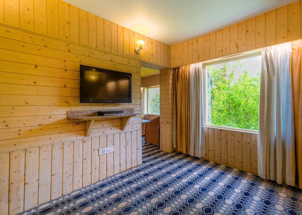 TV a/nebo společenská místnost v ubytování Hotel Mirage