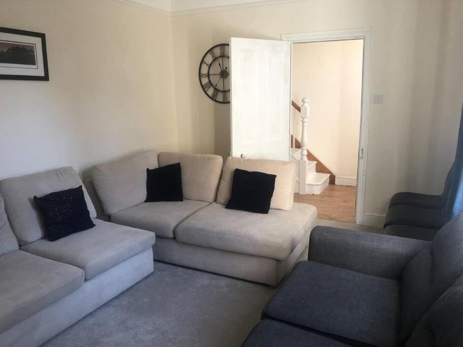 a living room with a couch and two chairs at Victorian Town House in Dover in Dover