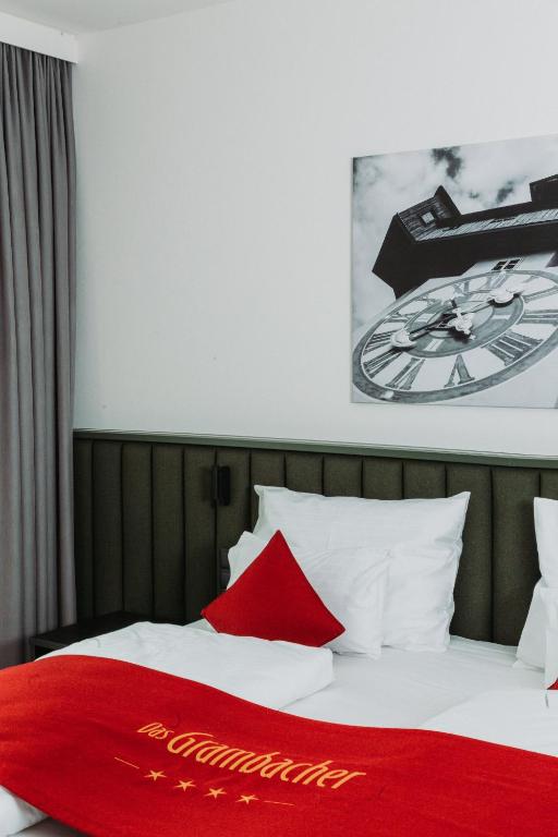 Postel nebo postele na pokoji v ubytování Hotel Das Grambacher