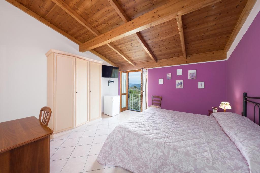 Postel nebo postele na pokoji v ubytování Agriturismo Daniela