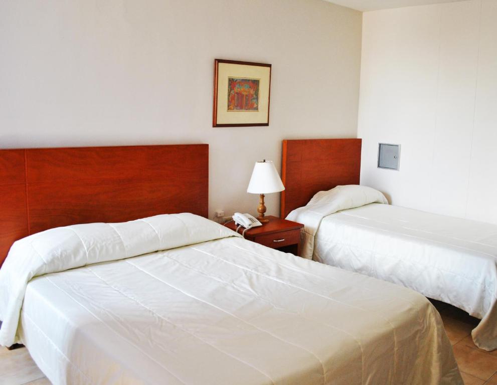 Postel nebo postele na pokoji v ubytování Hotel Majayura Sol