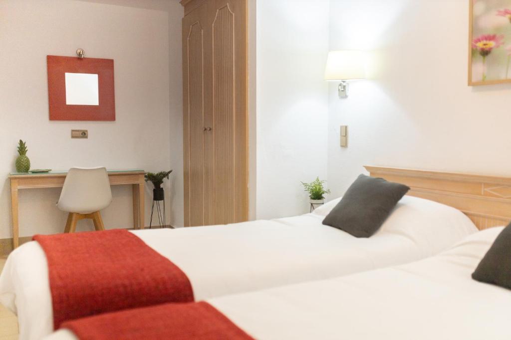 Posteľ alebo postele v izbe v ubytovaní Apartamentos Oasis Sol