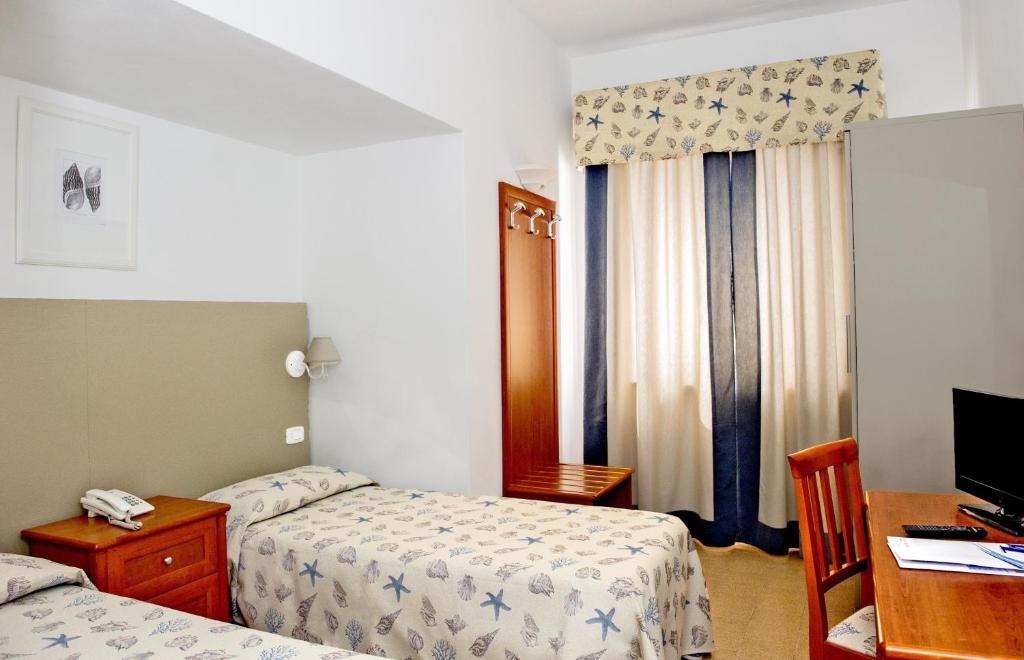 Posteľ alebo postele v izbe v ubytovaní Hotel Lucerna
