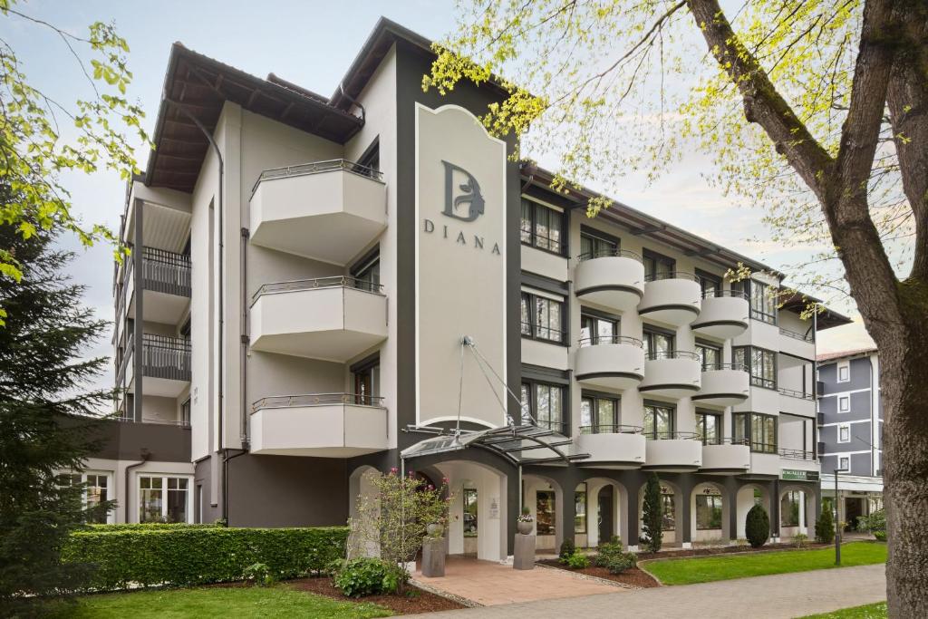 an apartment building with a sign that reads ab davis at Boutique Hotel Diana in Bad Füssing