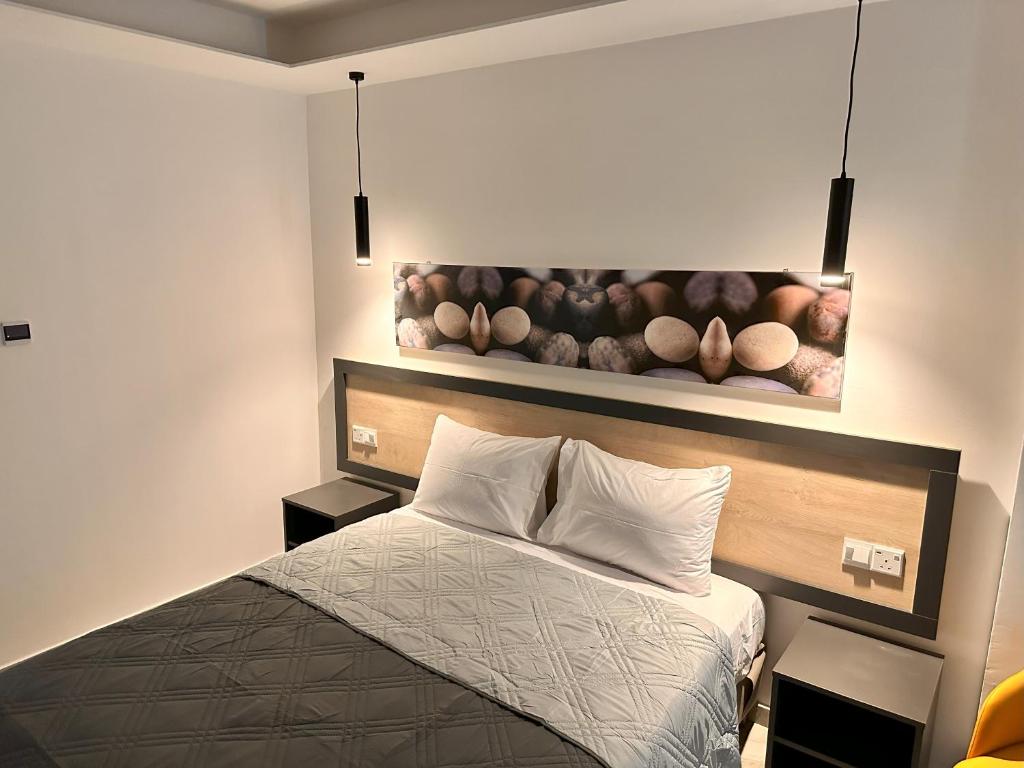 Postel nebo postele na pokoji v ubytování Papouis Protaras Hotel