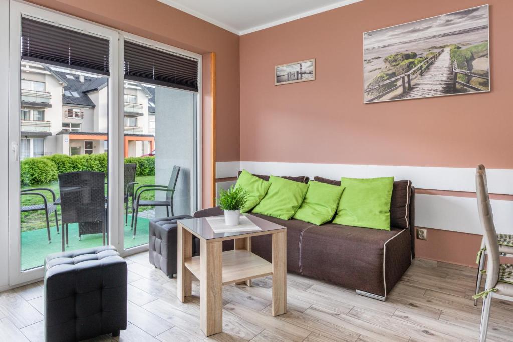 Posezení v ubytování Aqua Viva Darłowo Apartment by Noclegi Renters