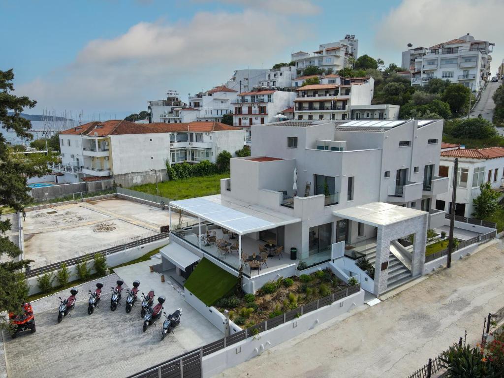 a group of motorcycles parked in front of a white building at Niso Skiathos in Skiathos