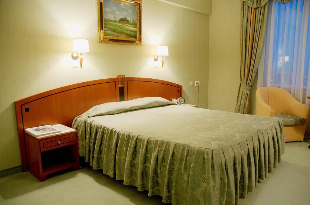 Postel nebo postele na pokoji v ubytování Mirage Hotel