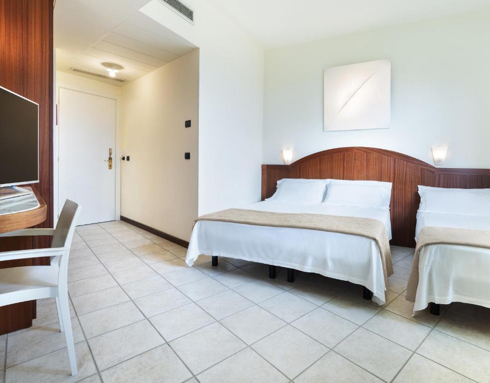 Postel nebo postele na pokoji v ubytování Hotel Bellevue Beach - sul mare