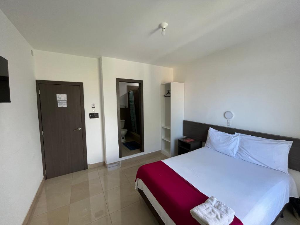 Postel nebo postele na pokoji v ubytování Mare S&M Casa Hostal