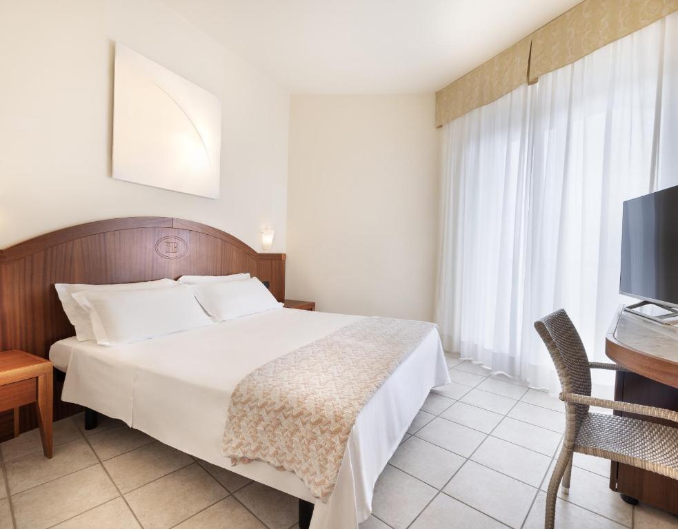 Postel nebo postele na pokoji v ubytování Hotel Bellevue Beach - sul mare