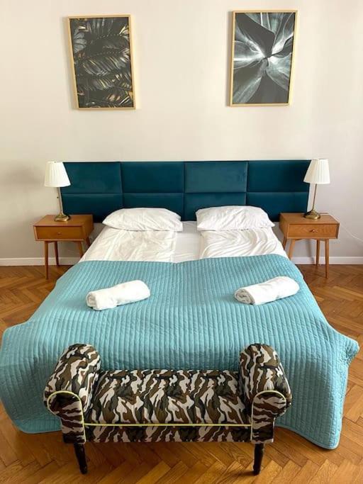 Posteľ alebo postele v izbe v ubytovaní Floriańska Grand Apartment 2