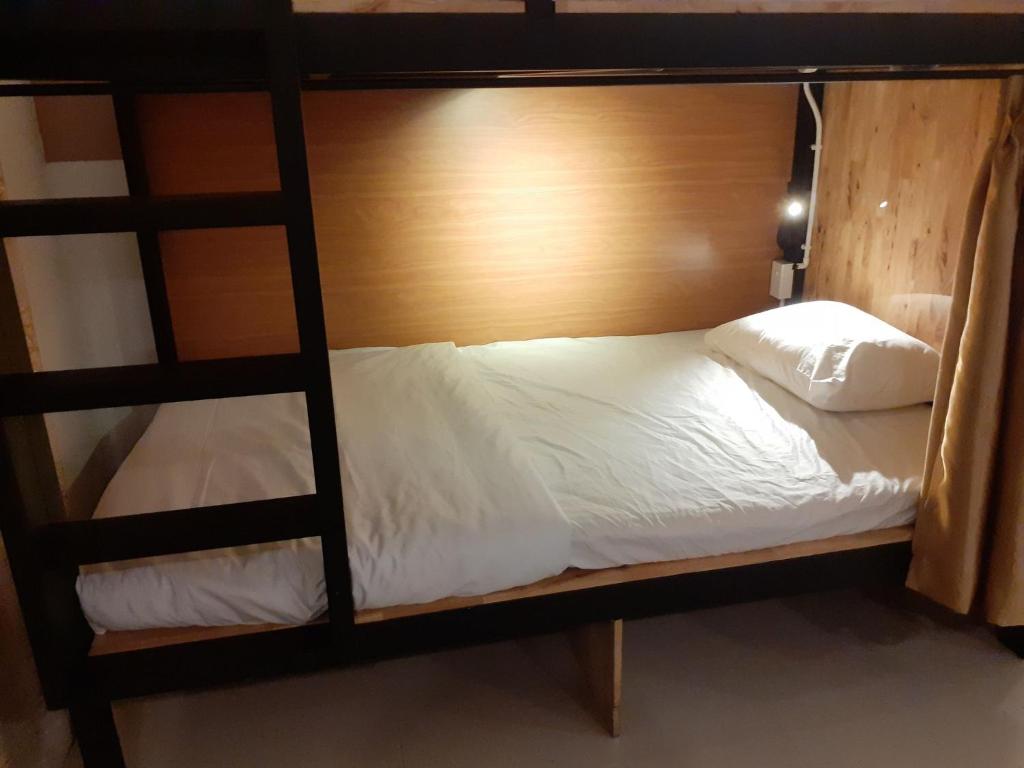 Postel nebo postele na pokoji v ubytování Hoang Thu Hostel