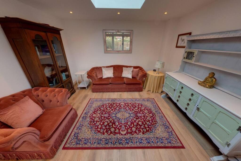 a living room with a couch and a rug at The Coach House in Westoe