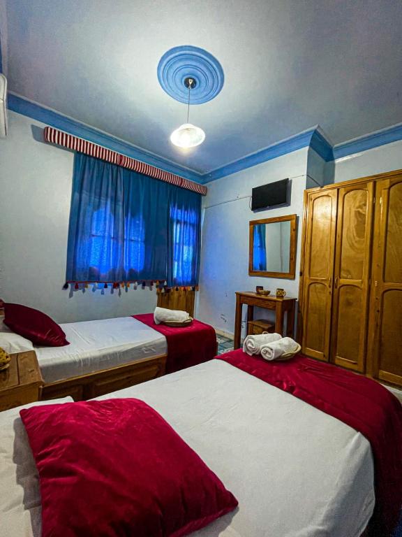 Voodi või voodid majutusasutuse Hôtel Al Kalaa toas