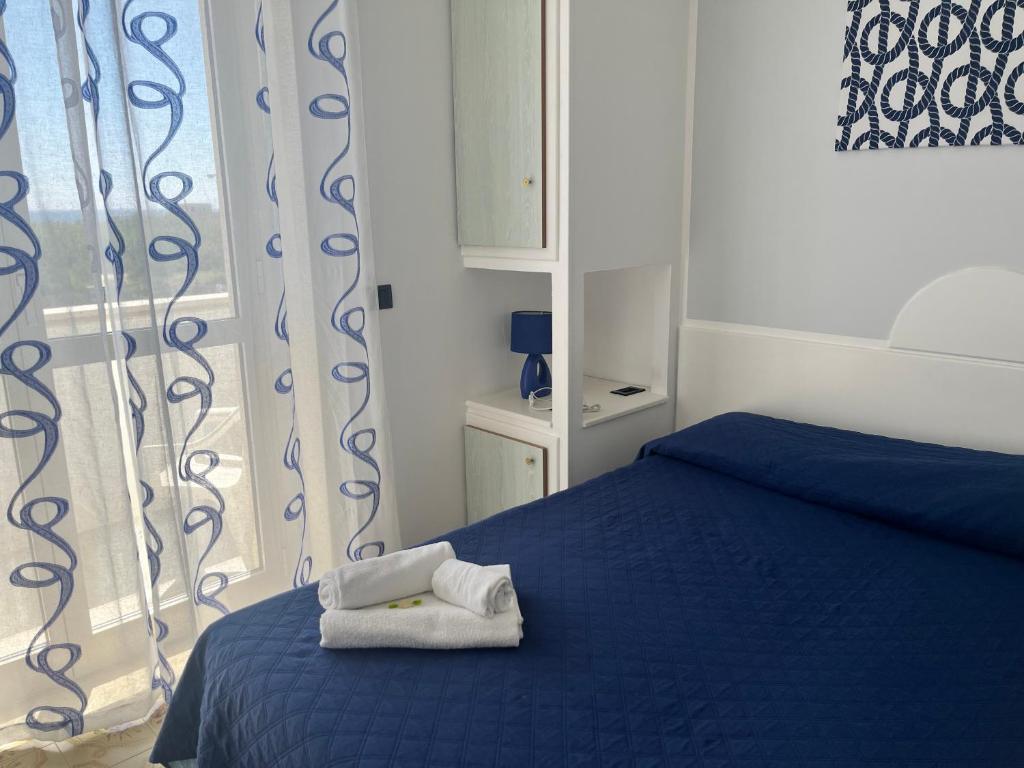 Postel nebo postele na pokoji v ubytování Hotel La Plancia