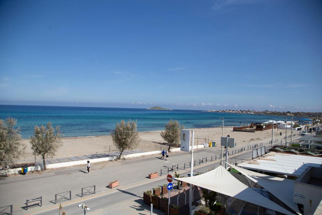 a view of a beach and the ocean at AR Palace Hotel - Palermo in Isola delle Femmine