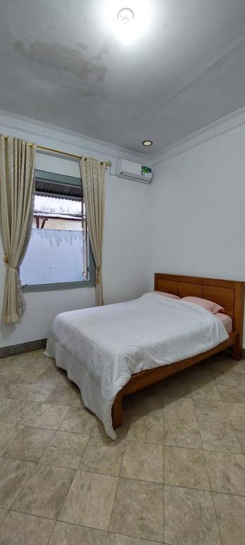 Postel nebo postele na pokoji v ubytování Omah Tegal Panggung 44